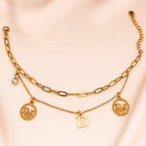 Layered Gold Bracelet with Initial and Logo Charms